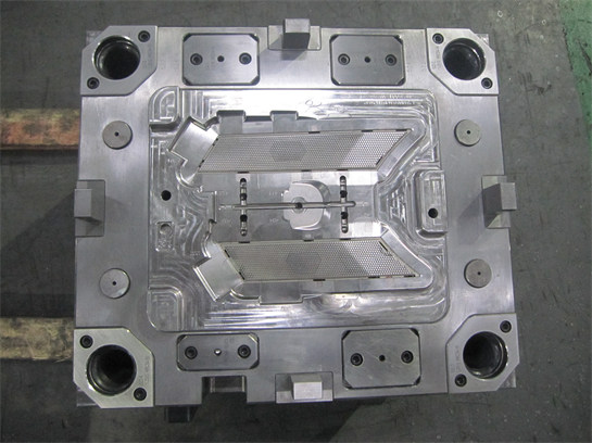 Automotive speaker grille moulds